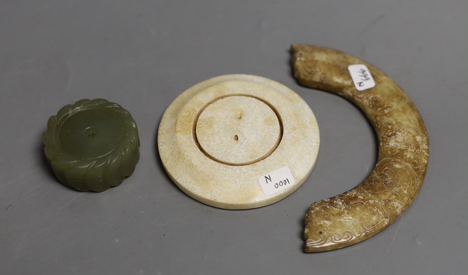 Three Chinese jade carvings - a huang, a disc and cash money